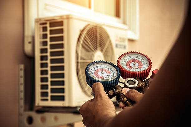 Professional Air Conditioning Service technician working in Fruitland, IA